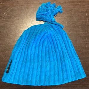 Knit blue obermeyer hat beanie with tassel
